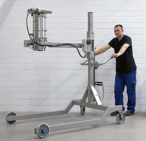 Volkmann vacuum conveyor raised on mobile post hoist with operator